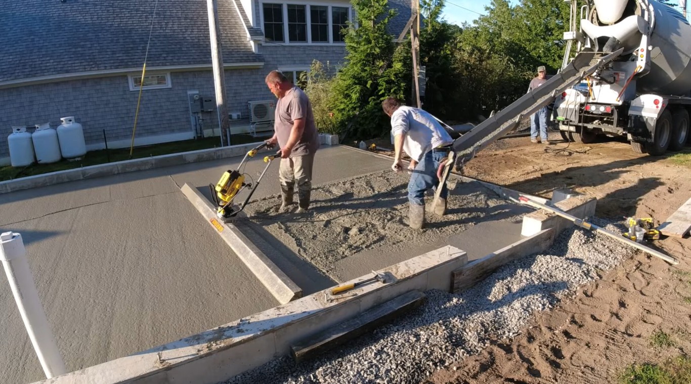 Concrete contractor pouring and finishing driveway in Leominster, MA